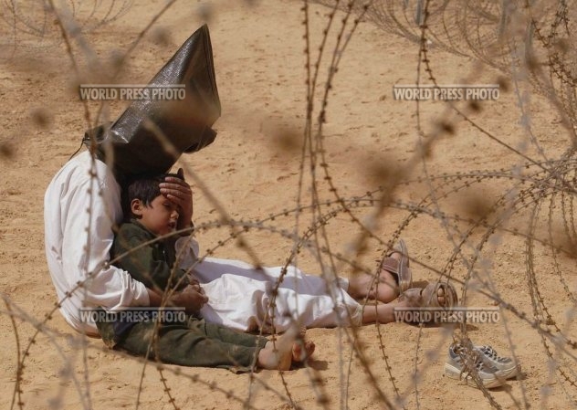 iraqi prisoner and child large 2003001